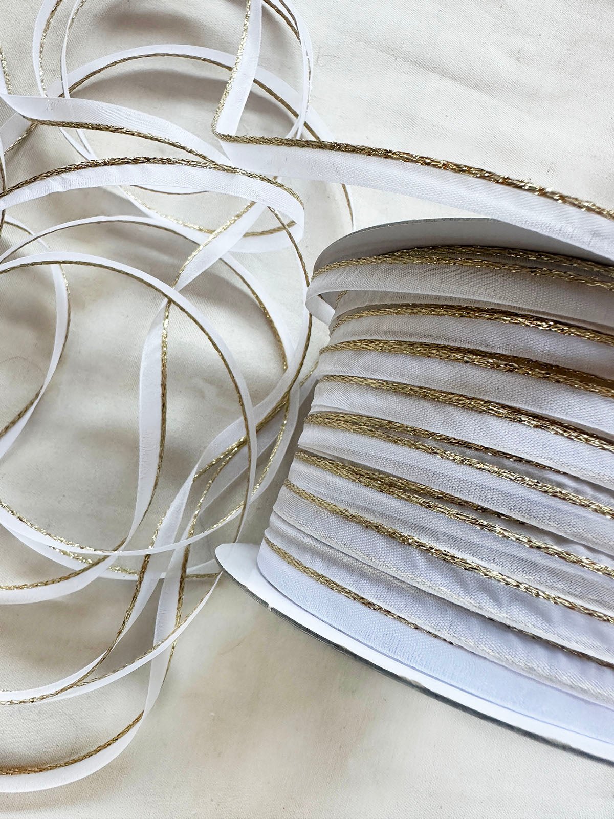Gold Sparkle White Organdy Piping - L'Etoffe Fabrics LLC