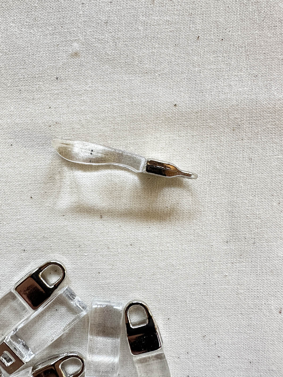 Designer Deadstock Zipper Pulls - Clear - L'Etoffe Fabrics LLC