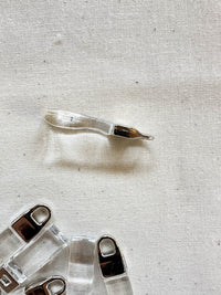 Designer Deadstock Zipper Pulls - Clear - L'Etoffe Fabrics LLC