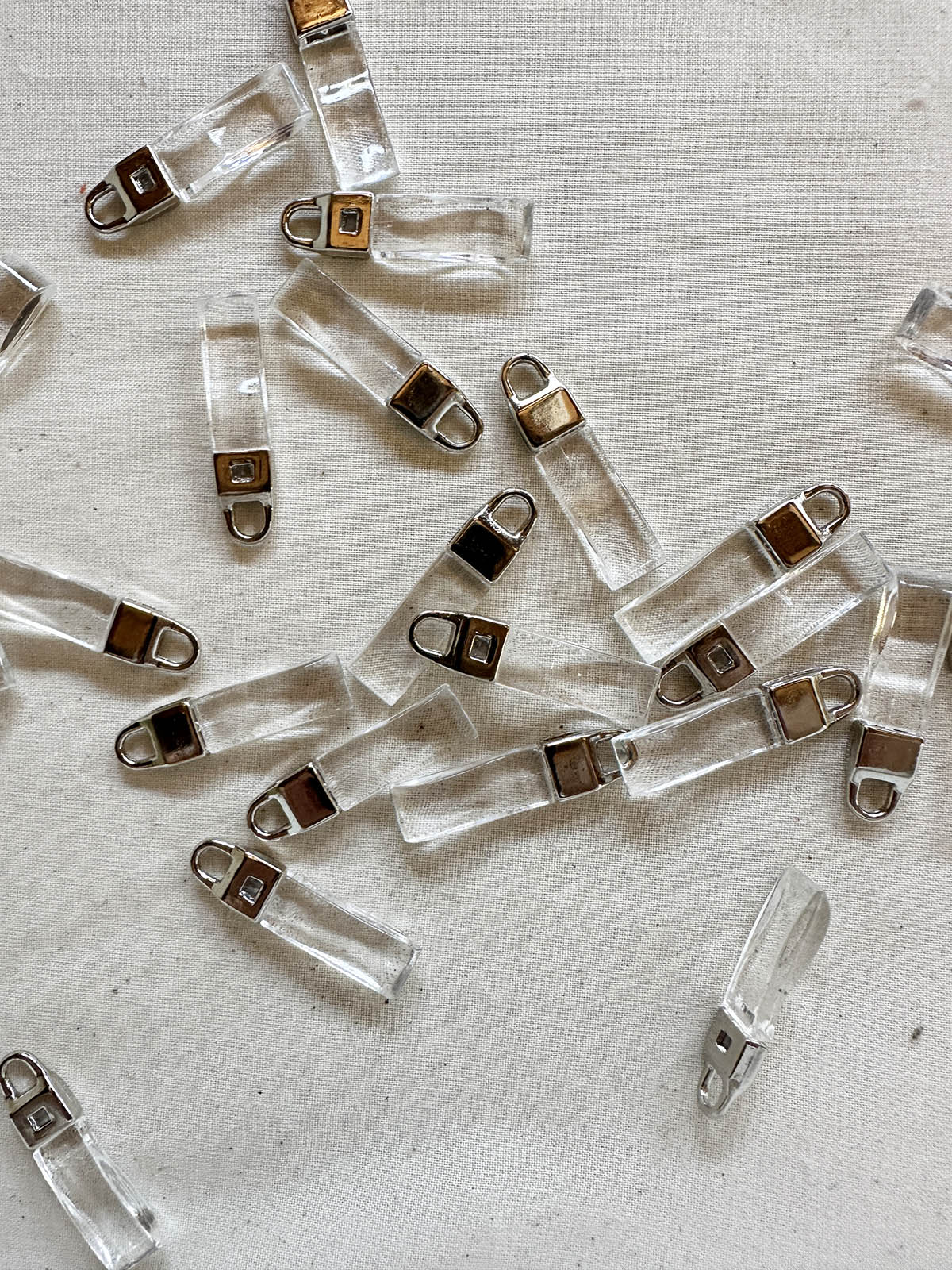 Designer Deadstock Zipper Pulls - Clear - L'Etoffe Fabrics LLC